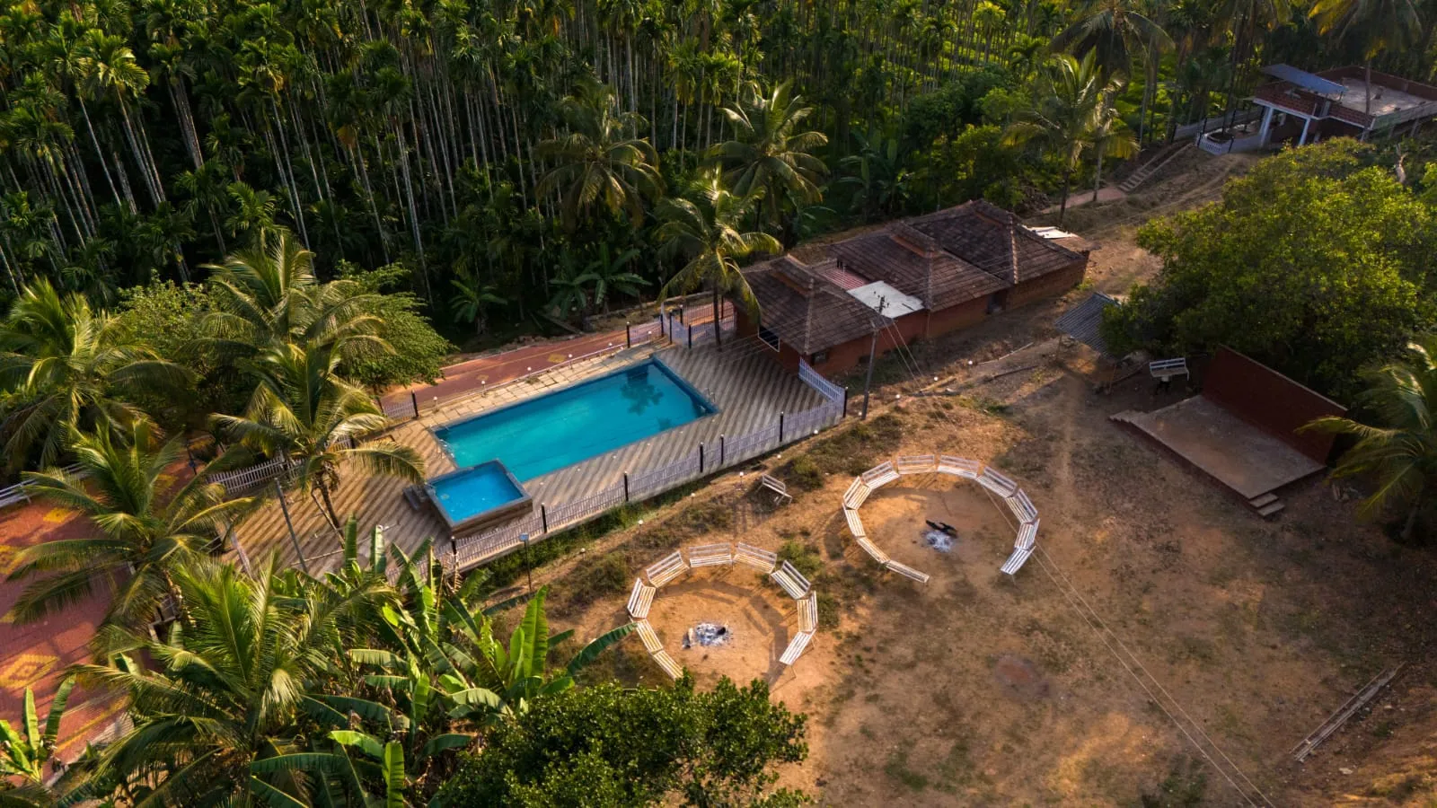 Resort exterior with lush greenery at the Dandeli riverside property